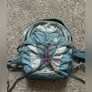 NORTH FACE backpack, used with a few very small stains on it, pictured.